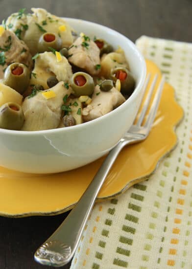 Healthy, hearty and weeknight easy, this chicken stew with lemon, potatoes, artichokes and olives recipe is a one pot wonder!