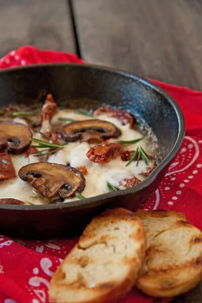 Mushrooms,-Sun-Dried-Tomatoes-and-Mozzarella dip in a skillet.