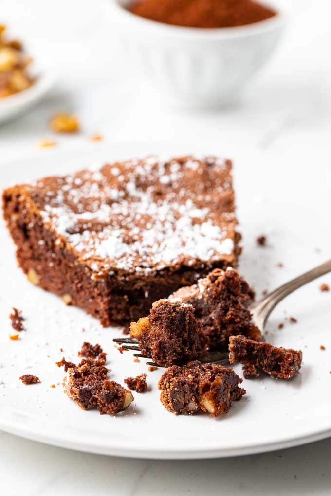 Slice of brownie pie on a plate with a fork