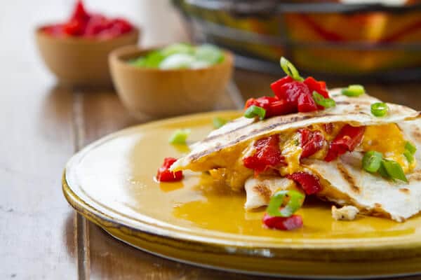 vegetarian quesadillas on a plate with roasted red bell peppers