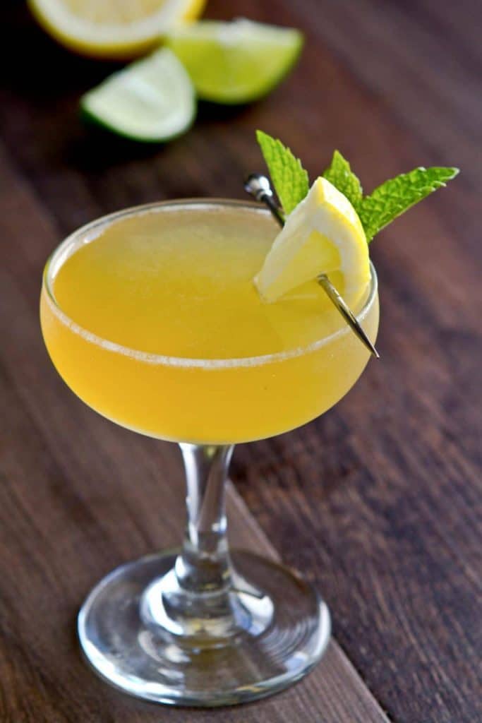 A glass with a Bourbon Lemon Drop Martini. 