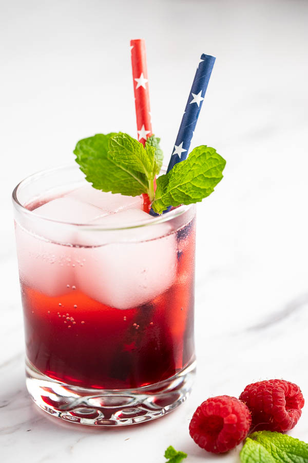 A raspberry mint vodka spritzer - an update to the classic vodka and club soda cocktail.