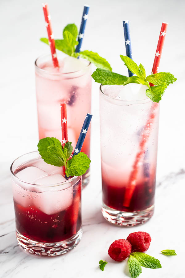 3 glasses of raspberry mint vodka spritzer.