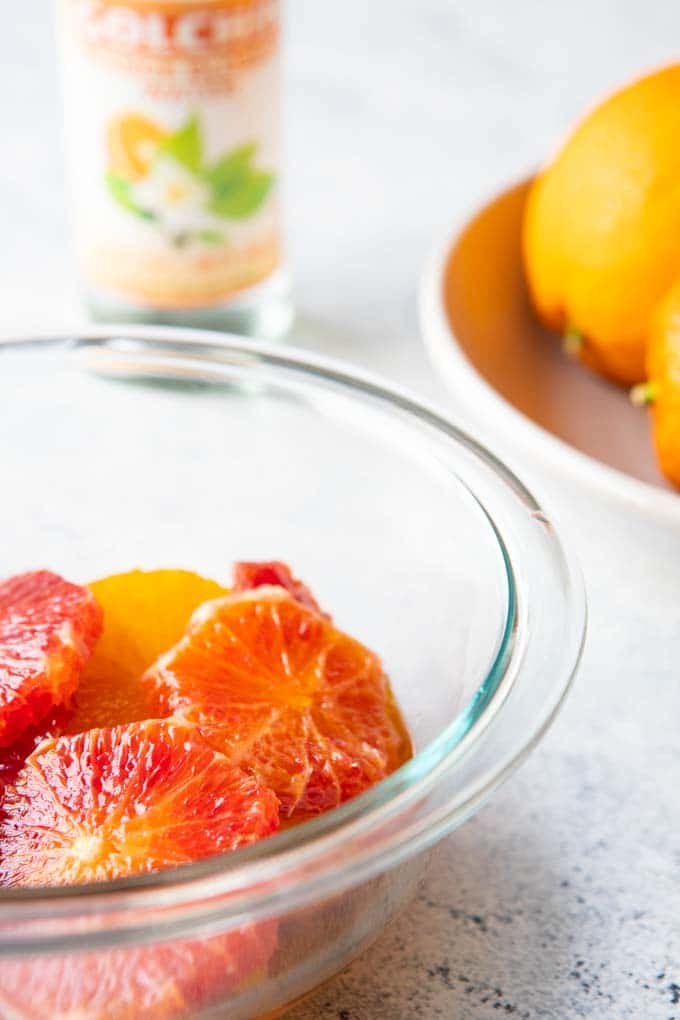 moroccan-citrus-salad Bowl of slice oranges marinating in the Moroccan Citrus Salad dressing.