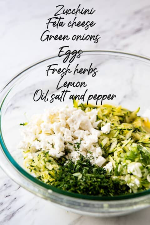 Ingredients needed to make zucchini cakes in a bowl