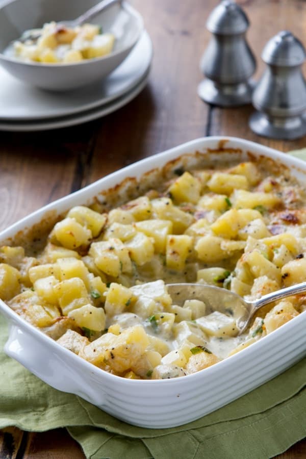 Rich, indulgent and easy, Potatoes Hashed in Cream casserole is a holiday must recipe! Make one day ahead and then straight into the oven!!