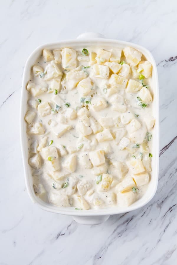 Rich, indulgent and easy, Potatoes Hashed in Cream casserole is a holiday must recipe! Make one day ahead and then straight into the oven!! 