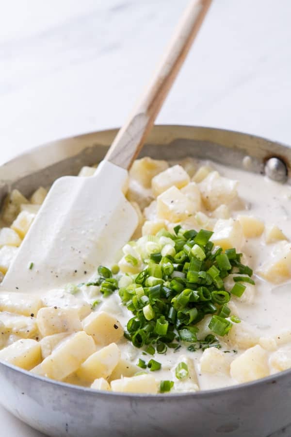 Rich, indulgent and easy, Potatoes Hashed in Cream casserole is a holiday must recipe! Make one day ahead and then straight into the oven!! 