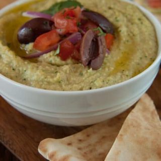 Herb hummus is the perfect hummus recipe!! This addictively good hummus has two "secret ingredients" that take it over the top!