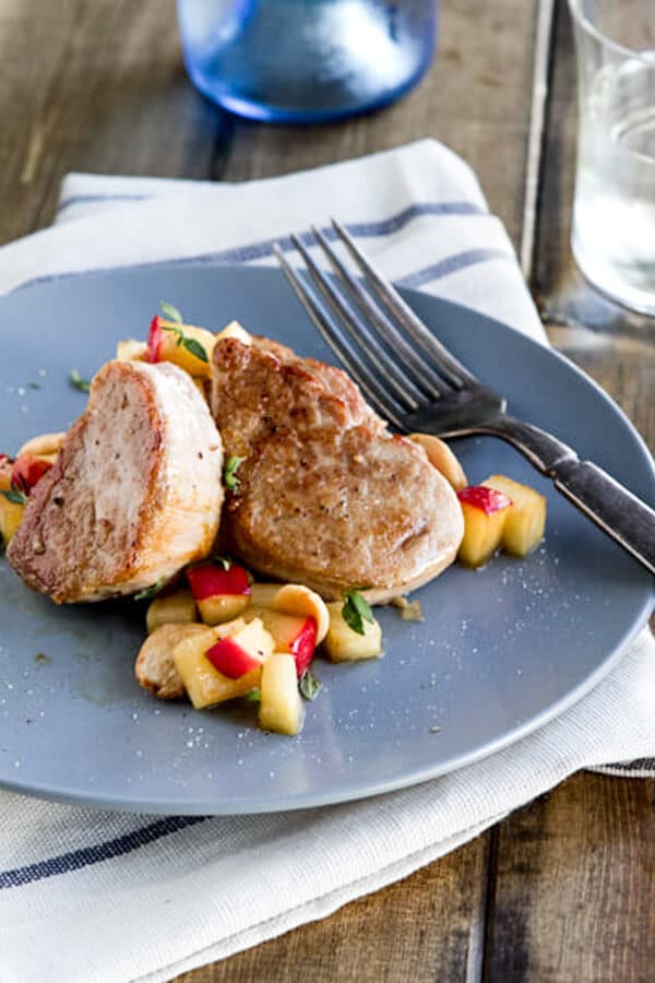 Simple and easy, this pork with apples and parsnips is flavored with a ginger and honey pan sauce. A one dish dinner that's ready in under 30 minutes.