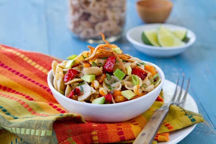 This Easy Mexican Style Pasta Salad with Chile Lime Dressing recipe is a summer potluck, party and backyard bbq star that can be made ahead.