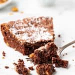 Slice of brownie pie on a plate with a fork