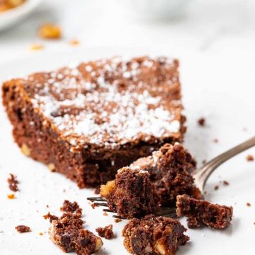 Slice of brownie pie on a plate with a fork