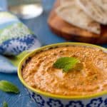 Kopanisti dip - a spicy and creamy dip from Greece, is flavored with red peppers, feta and mint. An Incredibly easy and delicious dip for any occasion.