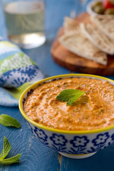 Kopanisti dip - a spicy and creamy dip from Greece, is flavored with red peppers, feta and mint. An Incredibly easy and delicious dip for any occasion.