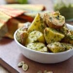 This Hatch Chile Pesto recipe, made from roasted New Mexico hatch chiles is terrific slathered on potatoes, chicken, fish, pasta or used a dressing!