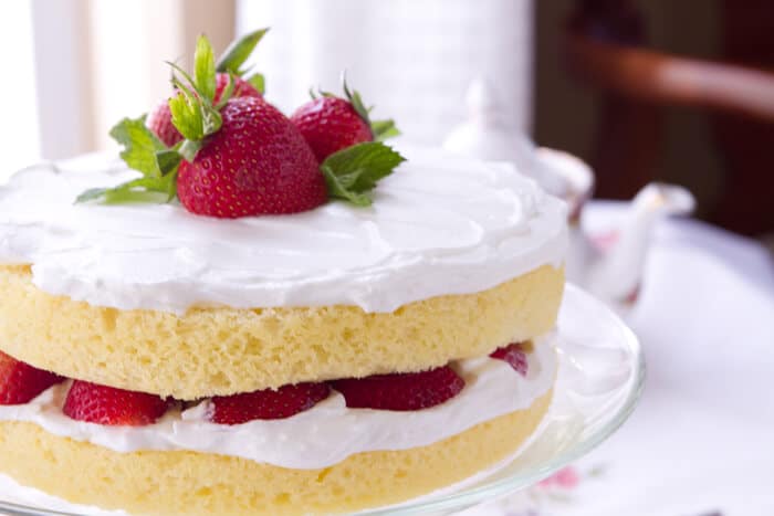 This easy vanilla scented Sponge cake with Lemoncello Cream and Strawberries is the perfect make ahead recipe - the secret is in the "cream".