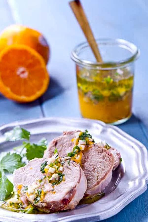 This Pixie tangerine Mojo is both sauce and marinade and the best thing that ever happened to pork! An healthy and easy weeknight recipe that's good enough for company and ready in under 45 minutes!