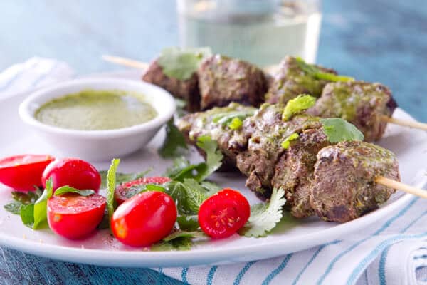 These grilled Mint, Coriander and Honey Kebabs are bathed in a sweet, tangy and herbaceous marinade that doubles as a dipping sauce.