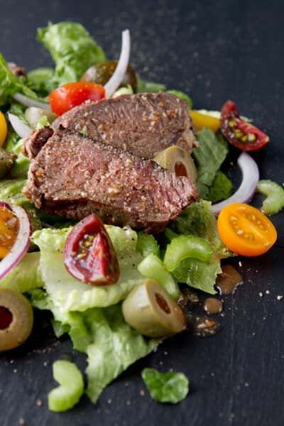This low carb main dish Tri Tip Salad with Bloody Mary Salsa recipe combines tomatoes, greens and olives with a zesty dressing that will satisfy even the most ardent meat eaters!