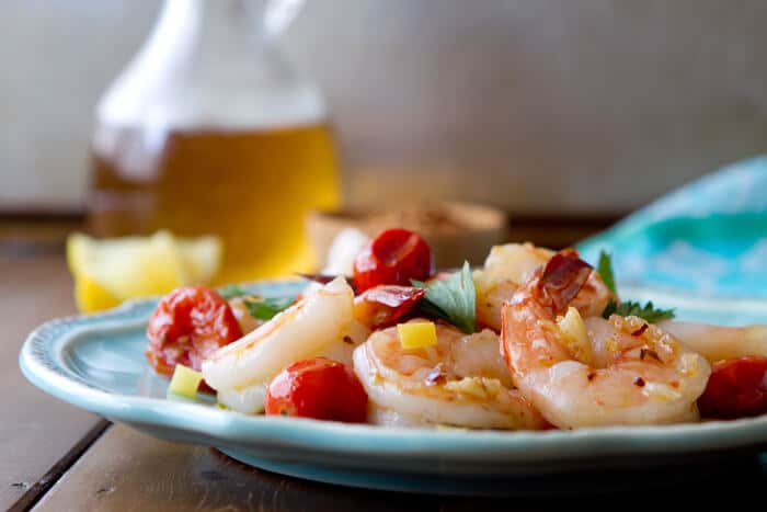 If you like shrimp scampi, you will love this easy, healthy one pan Oil Poached Spanish Sherried Shrimp recipe with lemon and tomatoes.