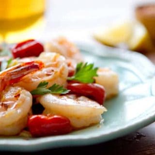 If you like shrimp scampi, you will love this easy, healthy one pan Oil Poached Spanish Sherried Shrimp recipe with lemon and tomatoes.