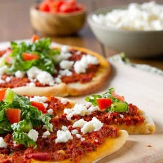 A latin take on a middle eastern flatbread, Chorizo Flatbreads with Queso Fresco and Tomato Salad are an easy, nutritious weeknight dinner!