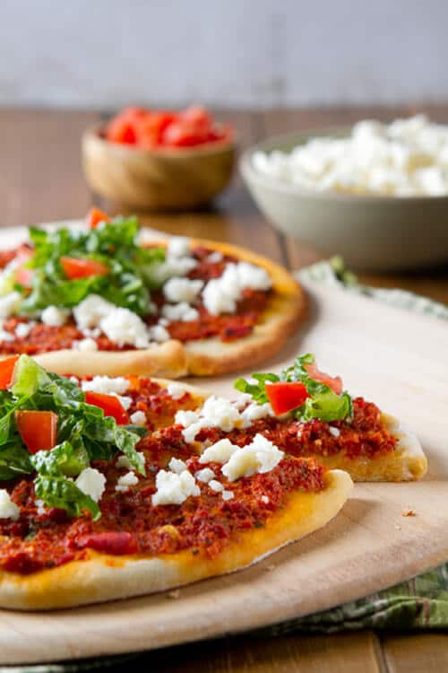 A latin take on a middle eastern flatbread, Chorizo Flatbreads with Queso Fresco and Tomato Salad are an easy, nutritious weeknight dinner!