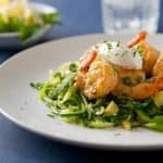 This healthy and gluten free Creamy Lemon Herb Shrimp bursts with fresh flavor! This easy, weeknight friendly one dish meal is pretty enough for company!