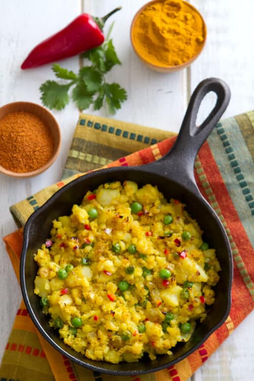 Fragrant with spices, this healthy, indian inspired Spiced Potato Hash recipe is a quick, colorful and nutritious vegetarian side dish. 