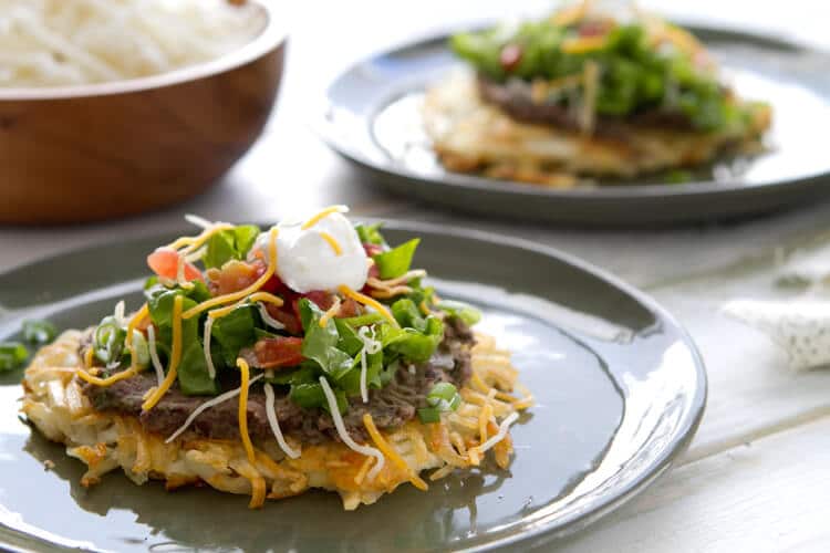 Frozen hash browns replace a tortilla in these Hash Brown Tostadas. Topped with lime and cilantro black beans it makes an easy 30 minute vegetarian dinner.
