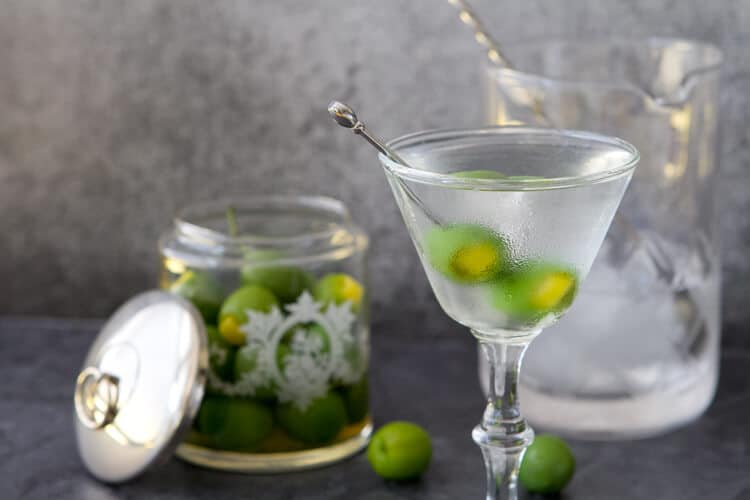 GIve the classic martini an update- this Mediterranean martini features a twist on the classic garnish with a burst of citrus flavor.