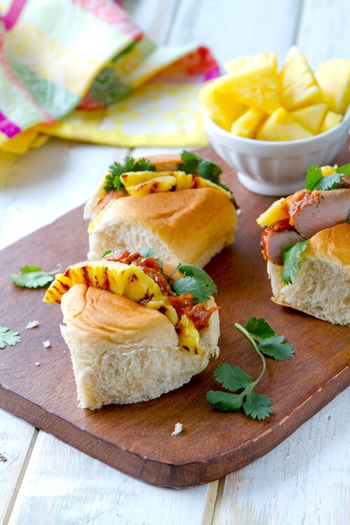 This recipe for Char Sui pork tenderloin sandwiches is a party pleaser with a sweet and spicy glaze,grilled pineapple in a Hawaiian roll that's easy to eat!