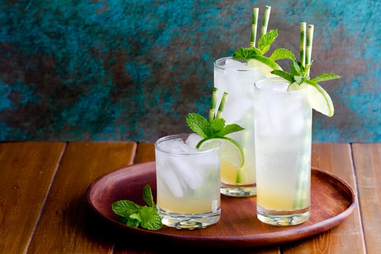 An infused simple syrup of with tropical flavors  is the secret to this refreshing Limeade Rum Fizz cocktail. 