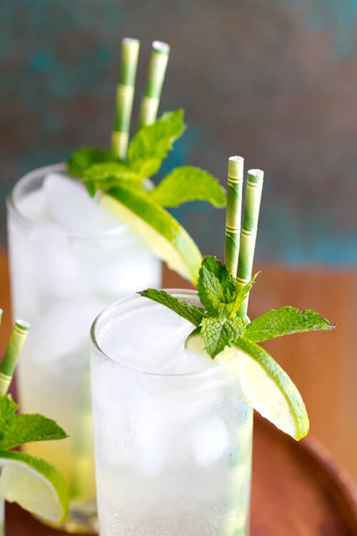 An infused simple syrup of with tropical flavors  is the secret to this refreshing Limeade Rum Fizz cocktail. 