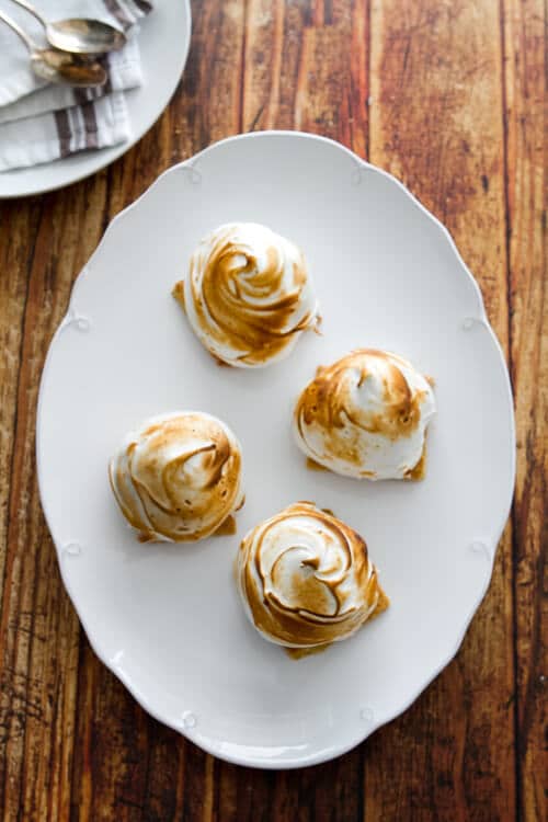 S'mores Baked Alaska! A cross between a s'more and an ice cream cone. An easy and fun summer dessert that's a snap to make!