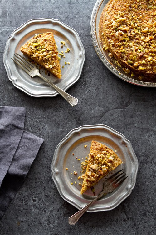 This Easy and Healthy Carrot Cake recipe is so moist, no frosting needed. Cardamon and pistachios give an Indian twist to this luscious cake.