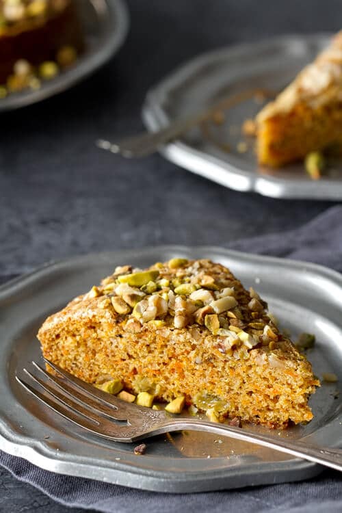 This Easy and Healthy Carrot Cake recipe is so moist, no frosting needed. Cardamon and pistachios give an Indian twist to this luscious cake.