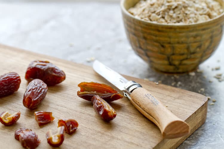 chopped up dates on a board for the Orange and Date Oatmeal