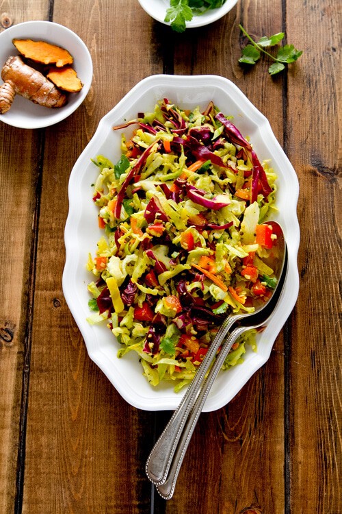 Indian spiced coleslaw with fresh turmeric, coconut, lime, chilis and cilantro