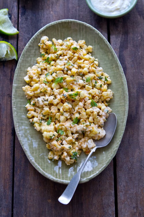 Lemon, lime, mayo and two cheeses flavor this Creamy Citrus Mexican Corn Salad that goes deliciously with anything from the grill!