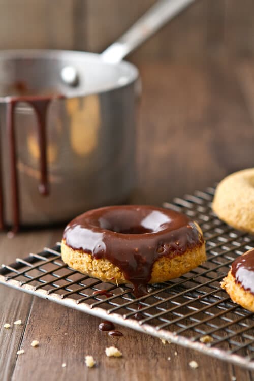 Freshly milled whole wheat flour is the secret to these nutty, moist and delicious 1 hour Whole Wheat Chocolate Glazed Donuts.  