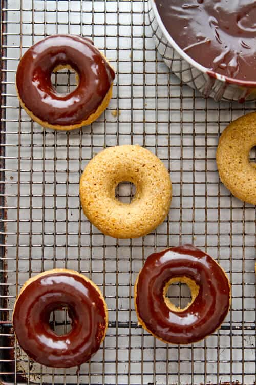 Freshly milled whole wheat flour is the secret to these nutty, moist and delicious 1 hour Whole Wheat Chocolate Glazed Donuts.  