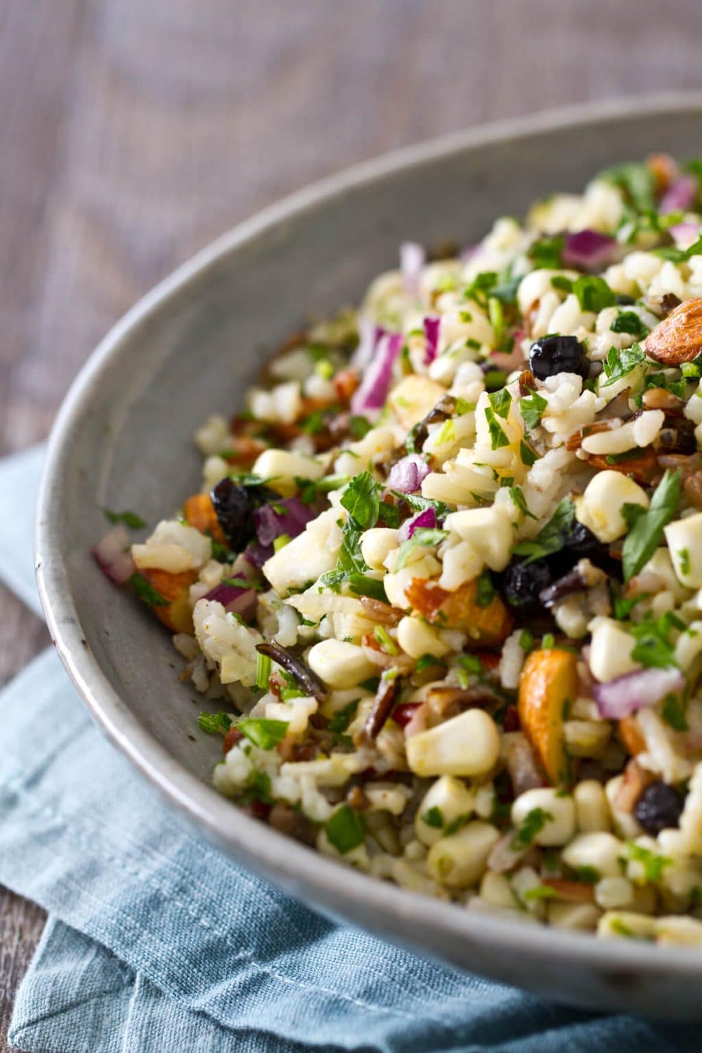 This cold Corn and Blueberry Wild Rice Salad recipe is sweet, salty and crunchy with a light, refreshing vinaigrette. A healthy side to eat all summer long!