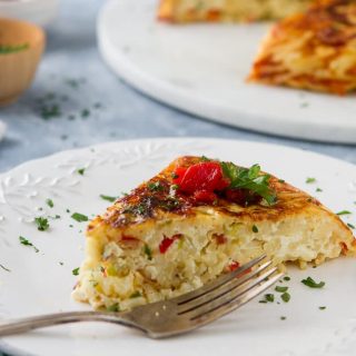 Eggs, cheese and red peppers come together in this easy Leftover Spaghetti Pasta Frittata. See my tips for this easy meal to have for dinner or brunch!
