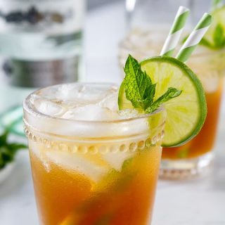 A close up of a rum moscow mule made with rum and ginger beer in a rocks glass.