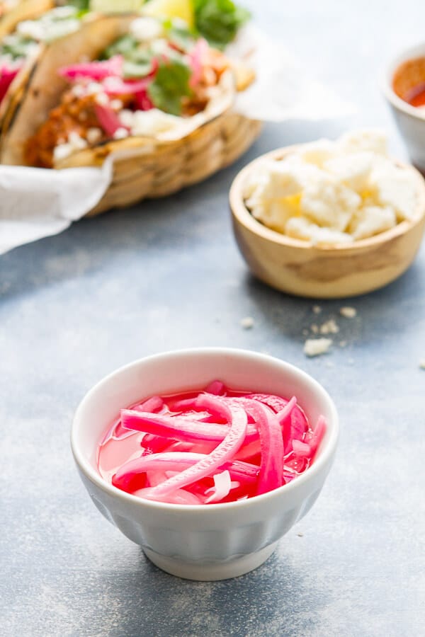 Juicy, tender and made in the slow cooker these mexican style pulled pork tacos have an earthy, citrusy flavor and are almost effortless! 