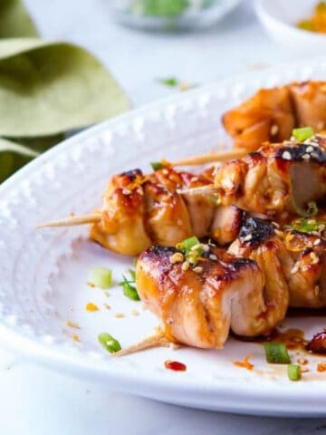 Teriyaki Chicken skewers on a platter.