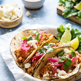 Juicy, tender and made in the slow cooker these mexican style pulled pork tacos have an earthy, citrusy flavor and are almost effortless!