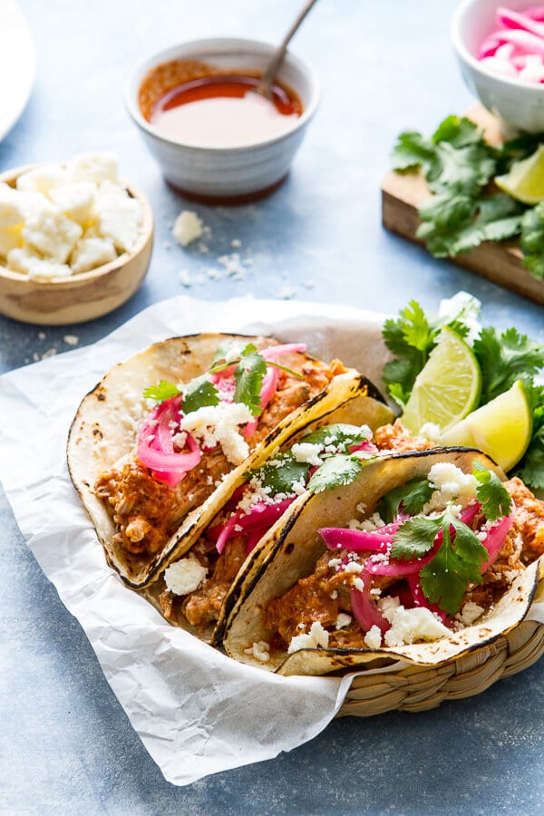 Juicy, tender and made in the slow cooker these mexican style pulled pork tacos have an earthy, citrusy flavor and are almost effortless!